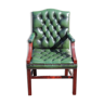 Mahogany armchair covered in green leather