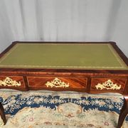 Louis XV style desk. Rosewood veneer, gilt bronze decoration, leather.