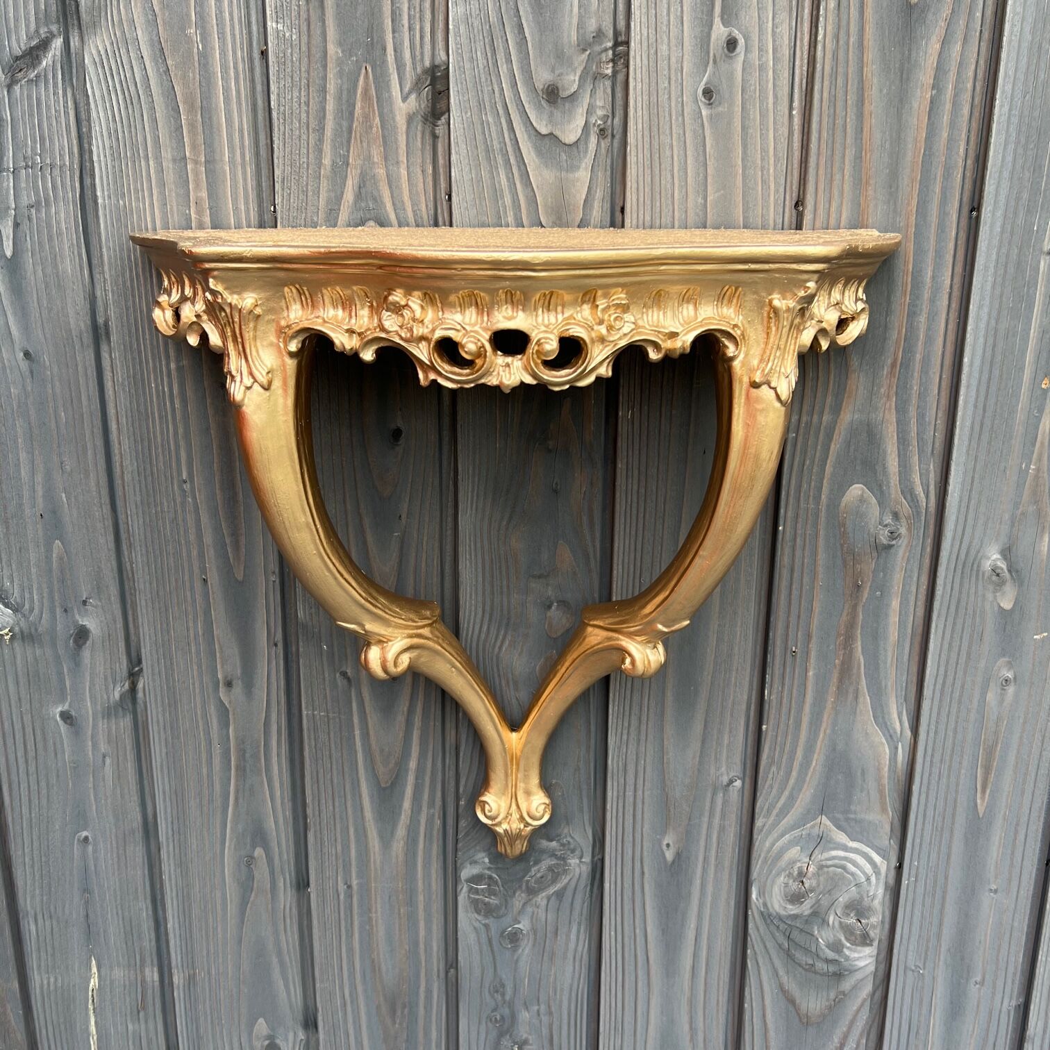 Golden wall console, baroque style