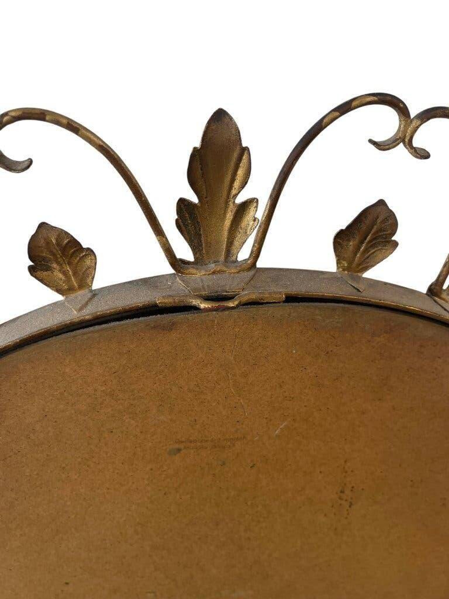 Vintage gold wall mirror with leaves