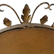 Vintage gold wall mirror with leaves