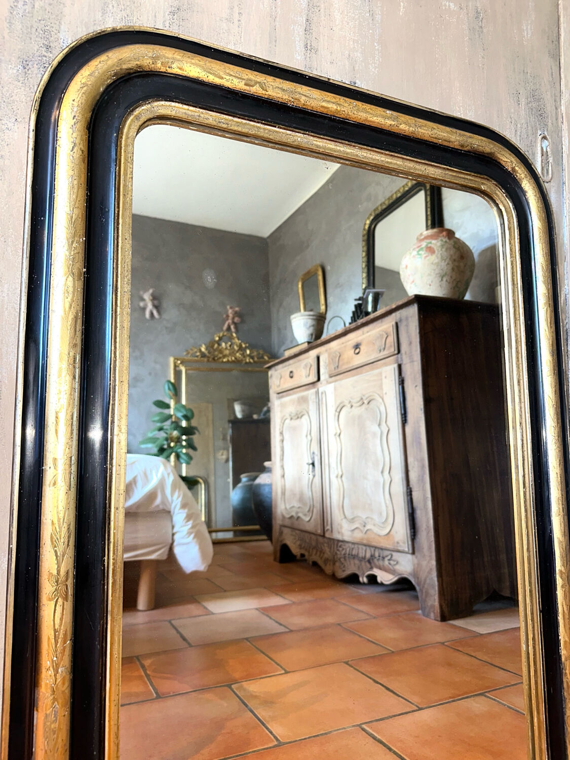 Louis-Philippe black and gold antique mirror from the 19th century