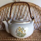 Vintage teapot with wicker handle