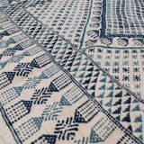 White and blue handwoven rug in natural wool