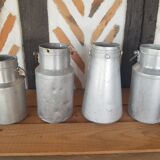 Set of 4 old metal milk canister jars