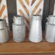 Set of 4 old metal milk canister jars