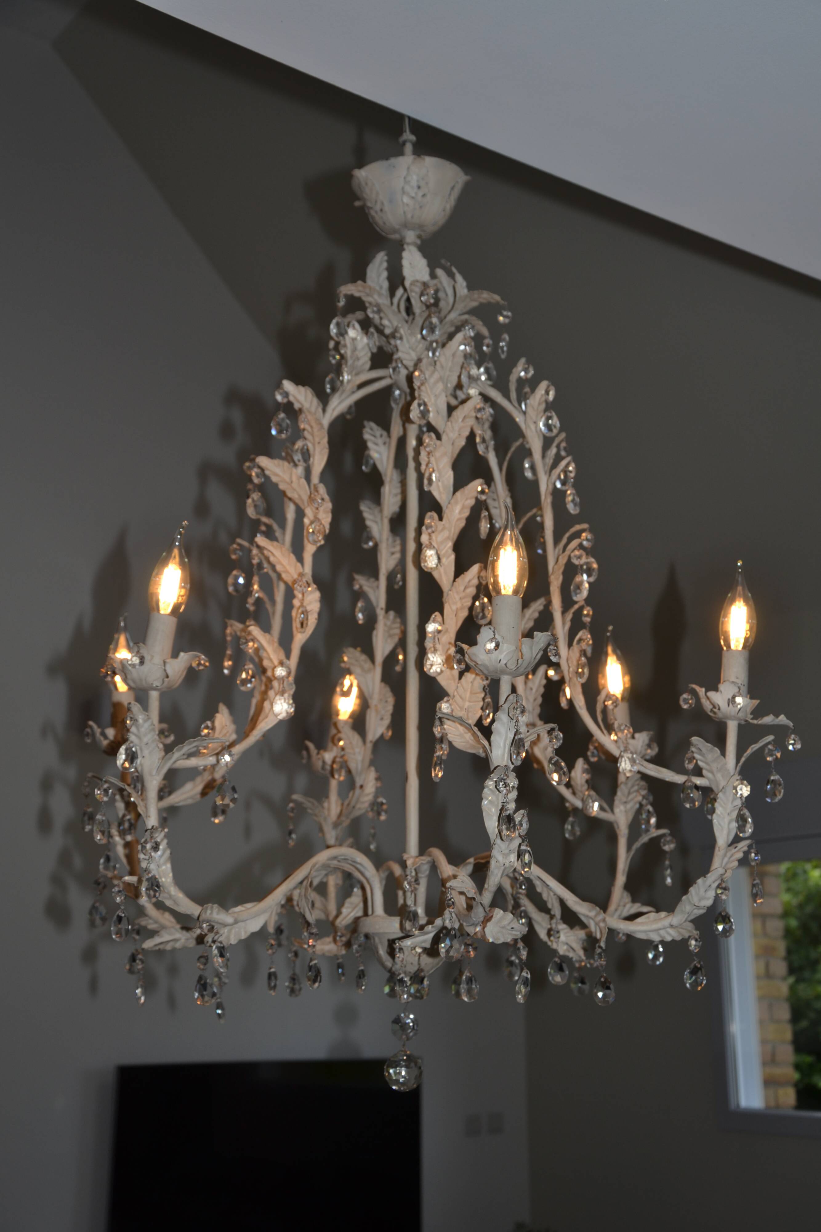 Large cage chandelier in aged metal.