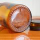 Small jar of amber glass apothecary with a flat cap