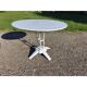 Garden table with a cast iron base and a metal top.