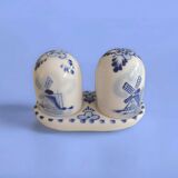 Mini salt and pepper shakers in ceramic with illustrations of Dutch windmills and blue flowers.