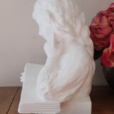 Plaster bust reading child