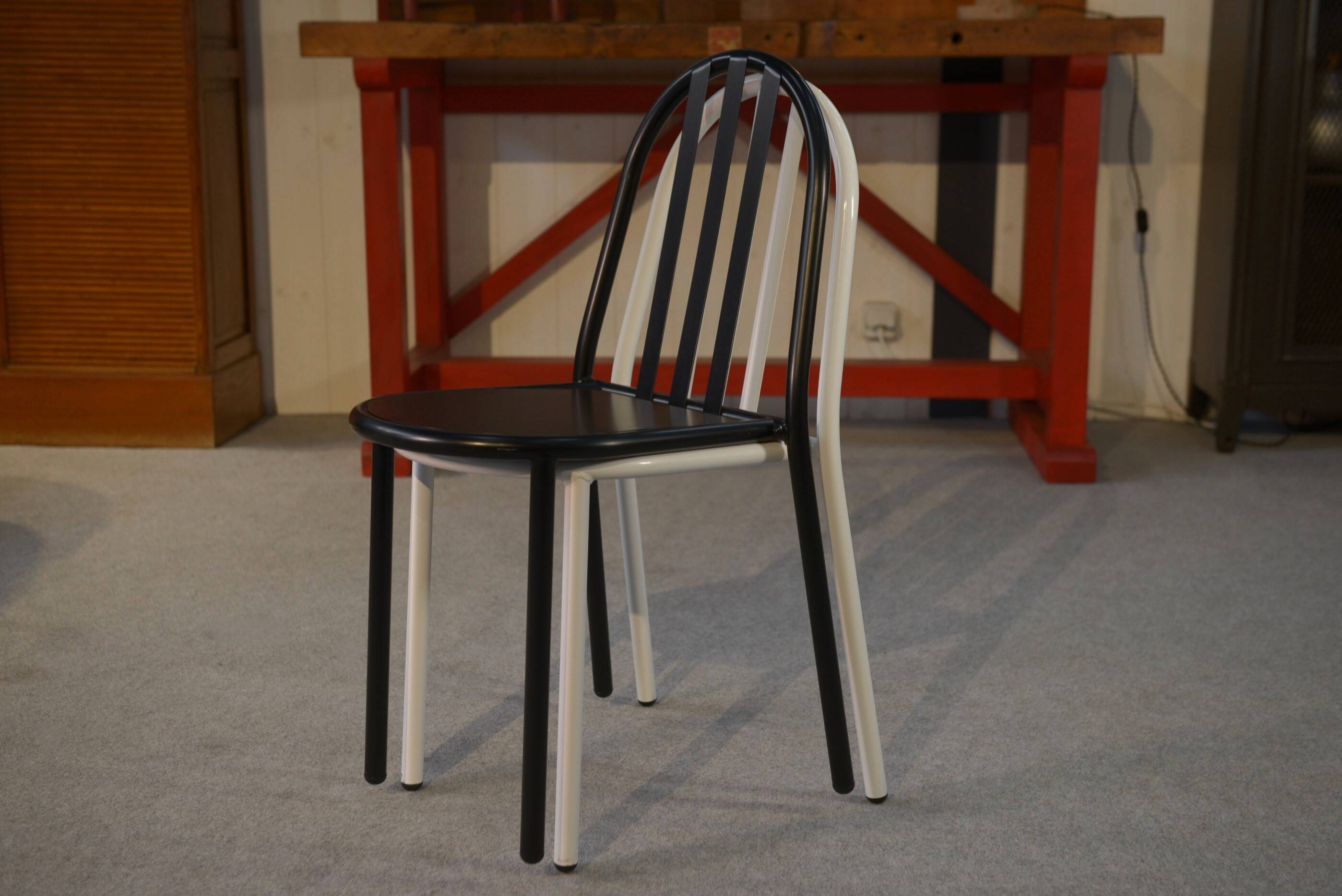 Pair of white and black chairs by Mallet Stevens