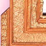 Miroir Napoléon III a riche ornementation dorée