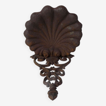 Old cast iron planter shell-shaped plant support