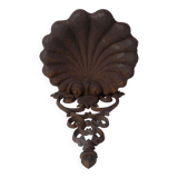Old cast iron planter shell-shaped plant support