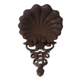 Old cast iron planter shell-shaped plant support
