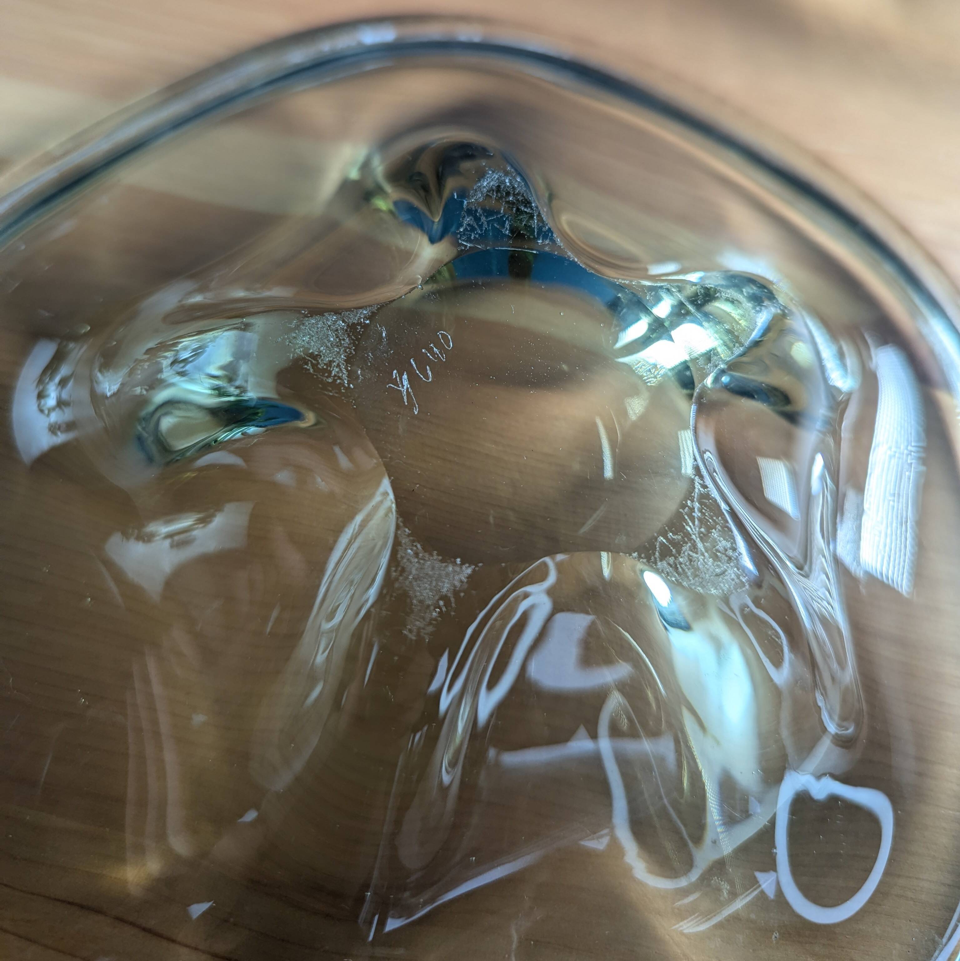4 wavy glass bowls plates in smoked green design, signed and numbered