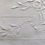 Old flat sheet embroidered and hand-opened