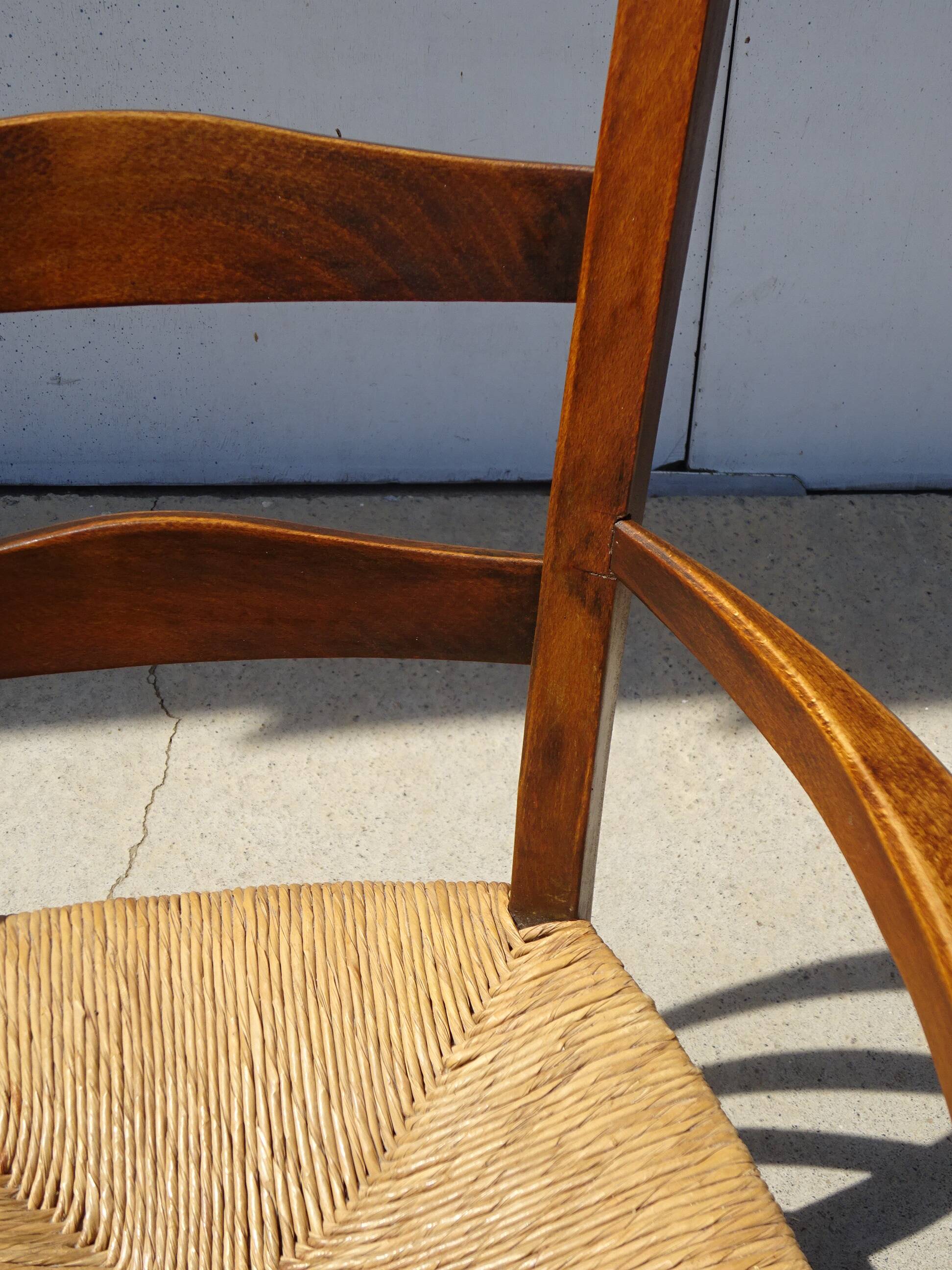 solid wood armchair, straw-covered seat