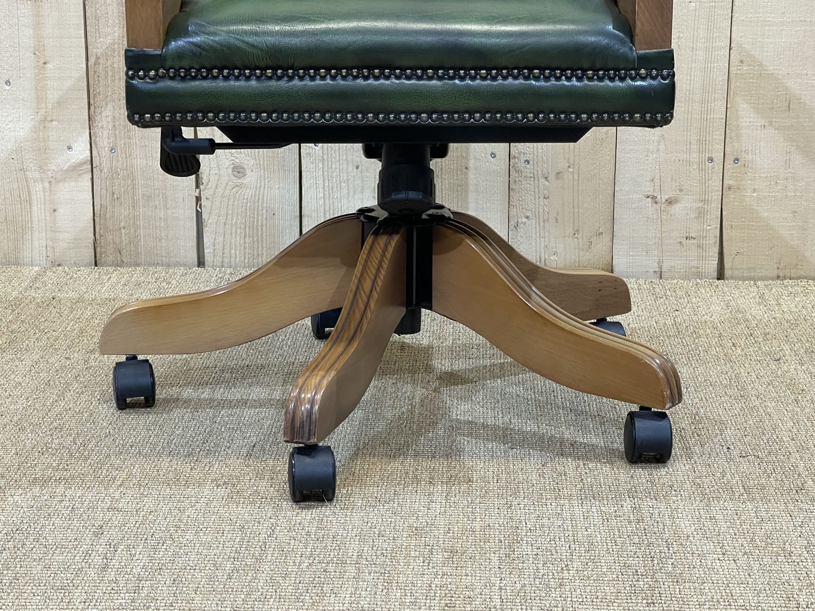 English chesterfield office armchair in green leather from the 1980s