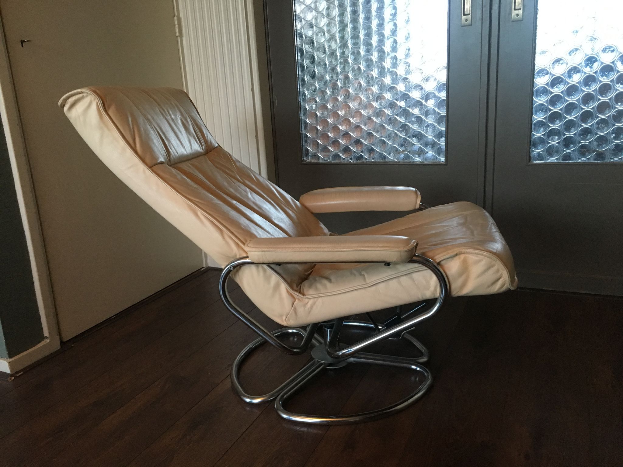 Mid-century danish leather & tubular steel swivel lounge armchair