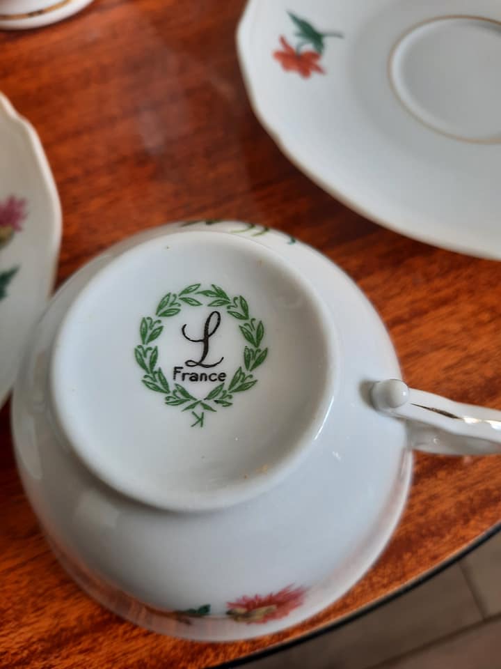 10 porcelain tea cups and 1 milk pot