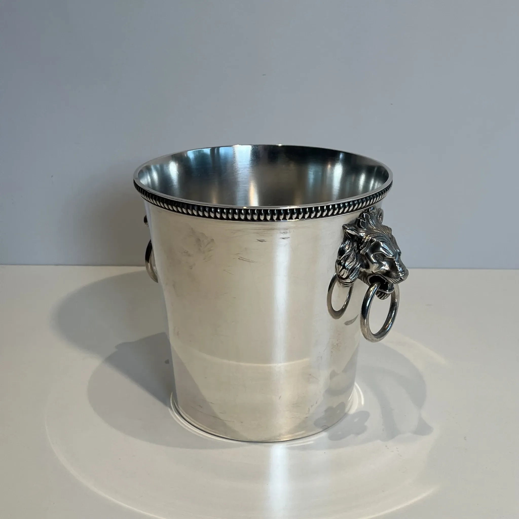 Silver-plated champagne bucket Orfèvrerie Saint-Médard. Handles in the shape of heads.