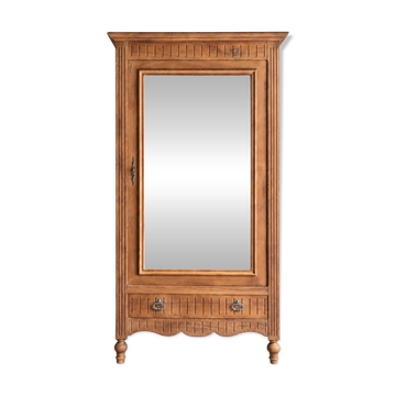 Antique walnut bonnetière with bevelled mirror.