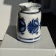 Artisan blue floral decorative carafe, height 17 cm, diameter 24.5 cm.