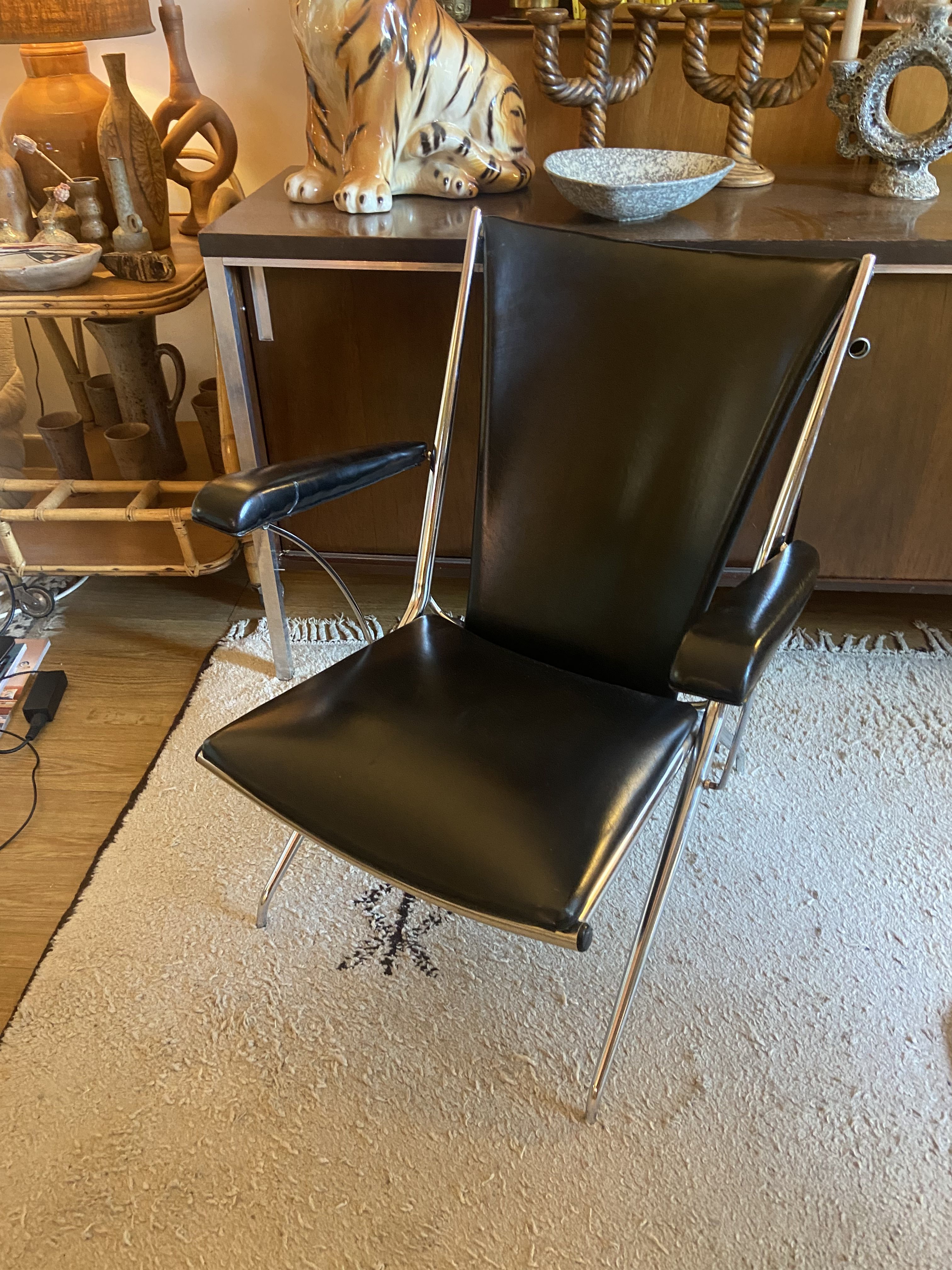 Metal armchair and black skaï