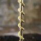 Pair of Art Deco twisted brass candlesticks, France, 1930s