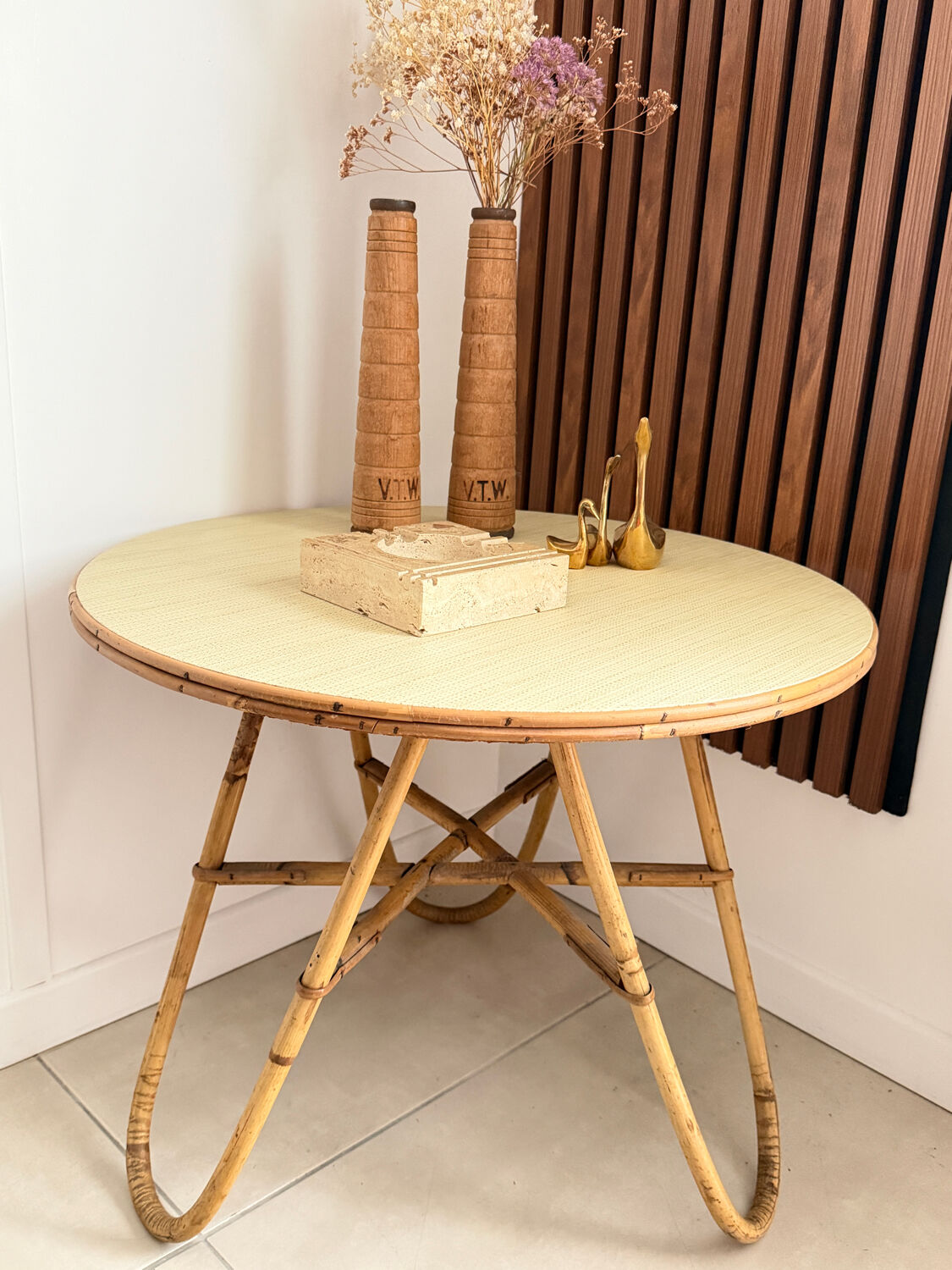 Vintage round tripod side table in rattan