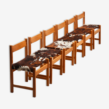 Series of 6 chairs in pine and cowhide 1970