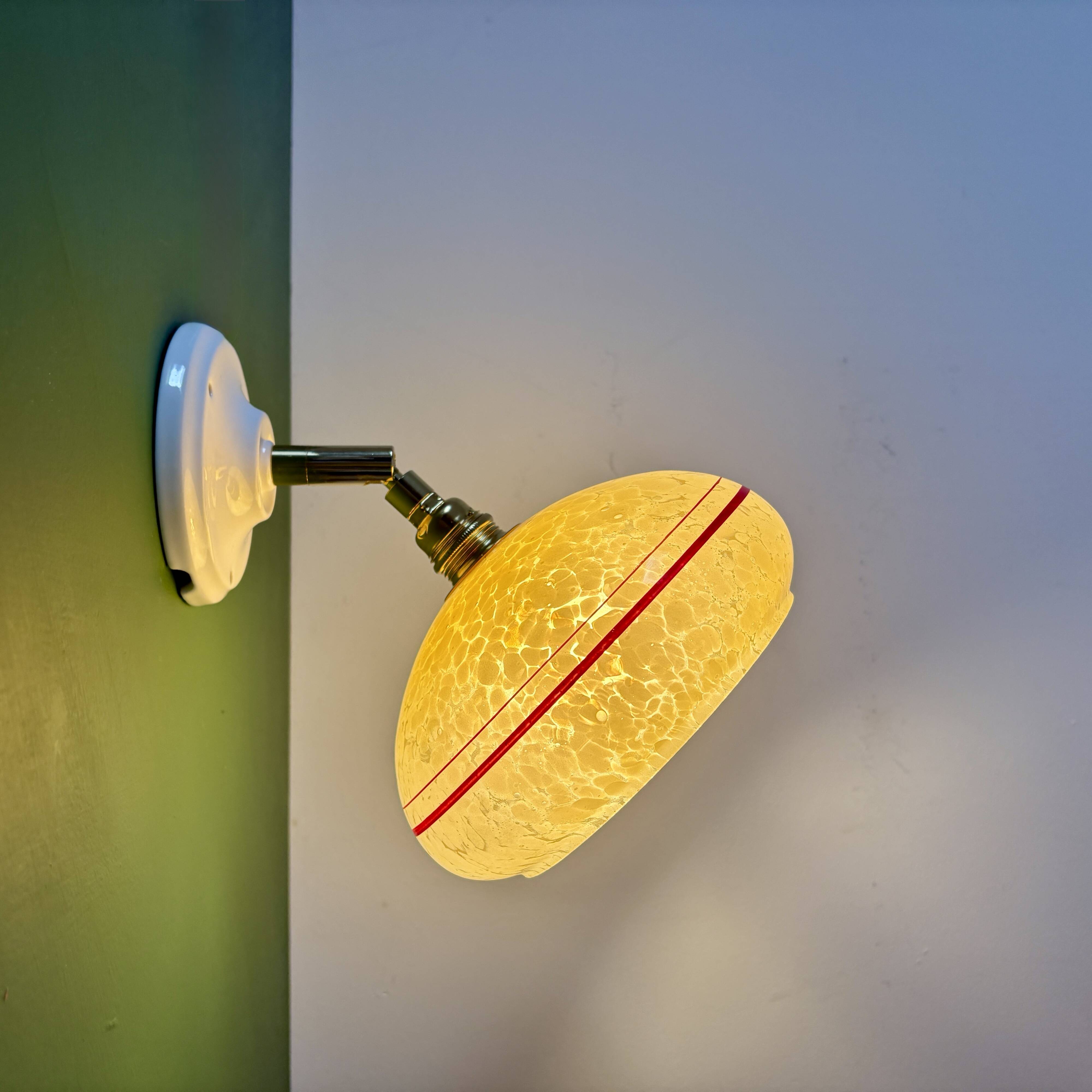Vintage wall lamp with yellow clichy glass shade and red trim