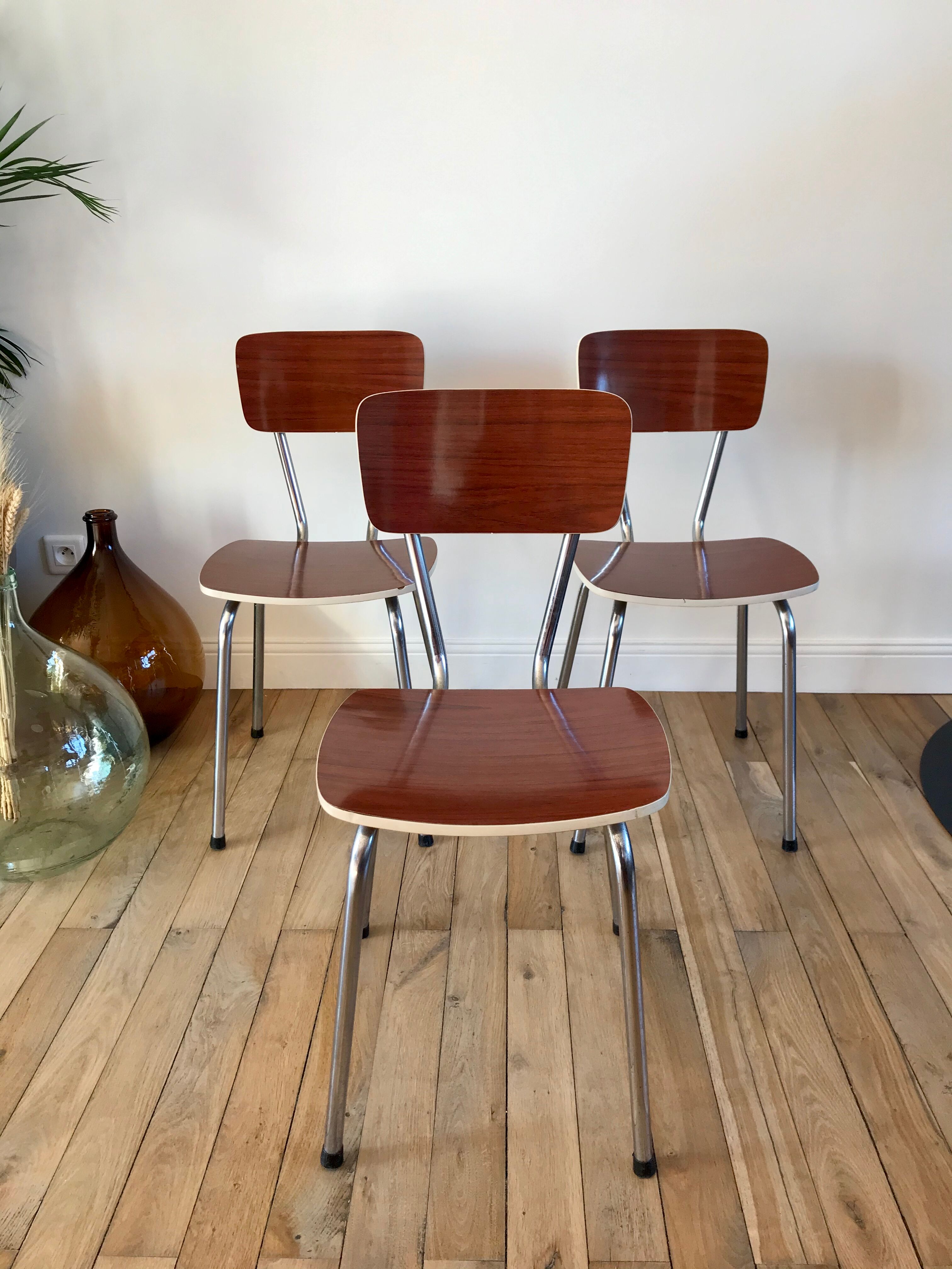 Trio of chairs in light brown formica and cream contour 70s