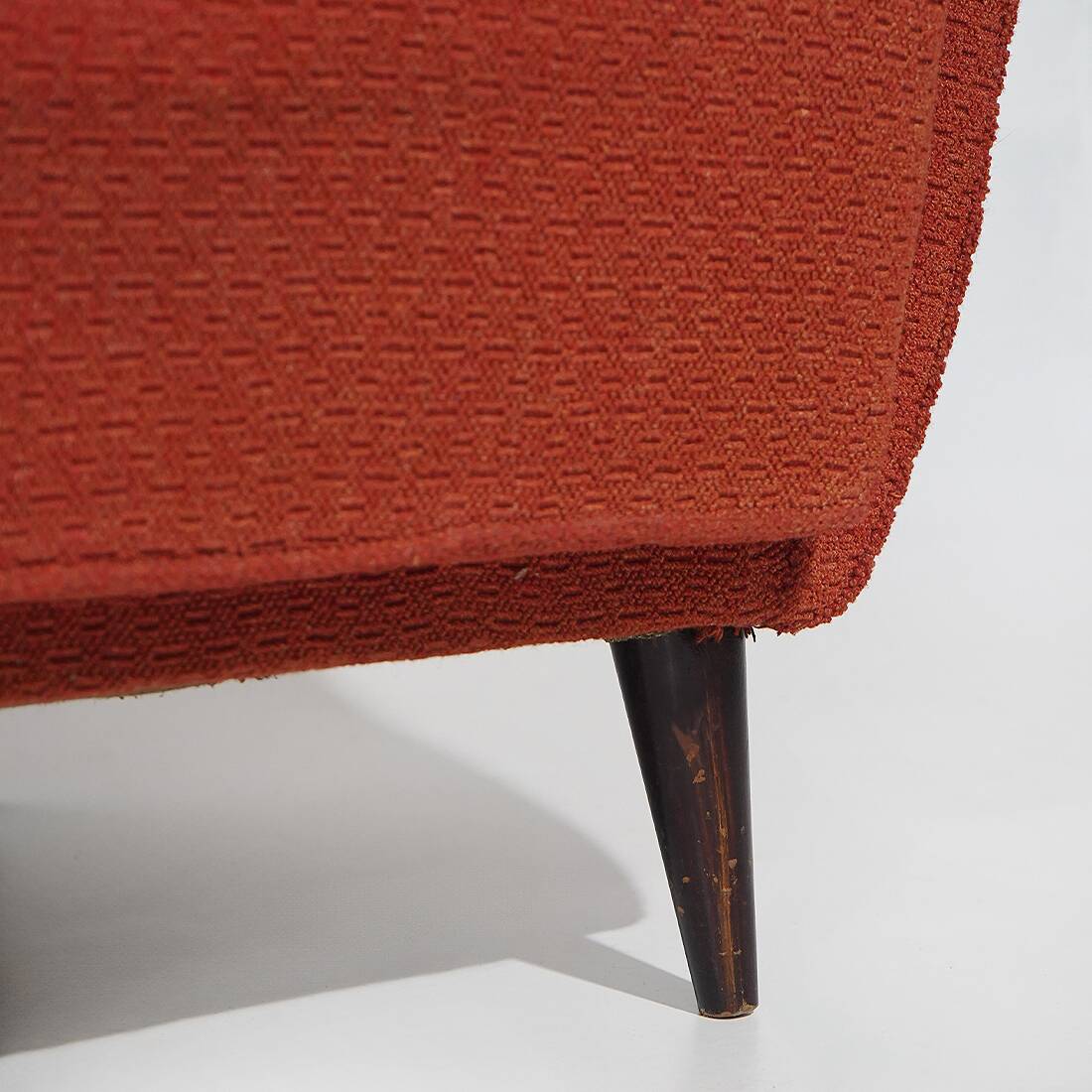 Pair of red armchairs with cone-shaped feet, 1950s