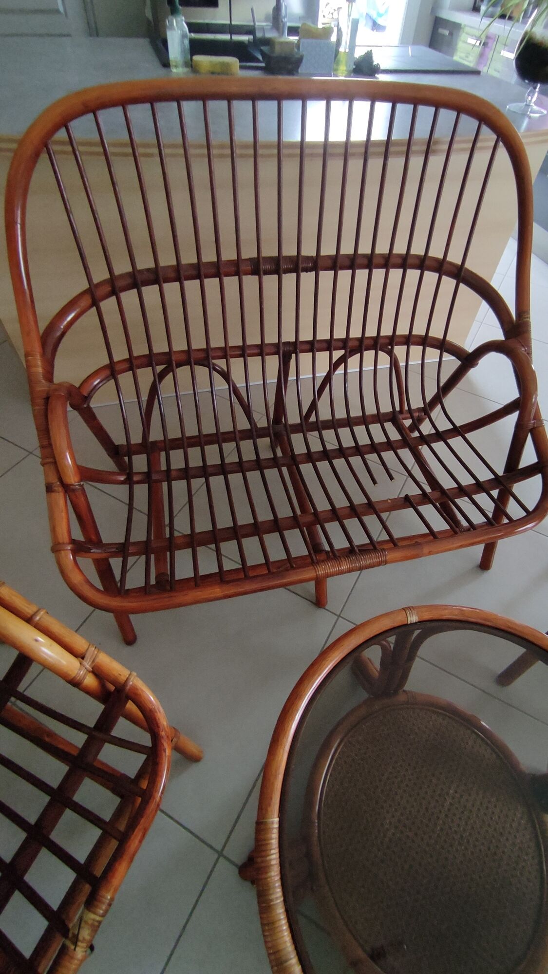 Sofa armchairs and coffee table in vintage rattan of six pieces