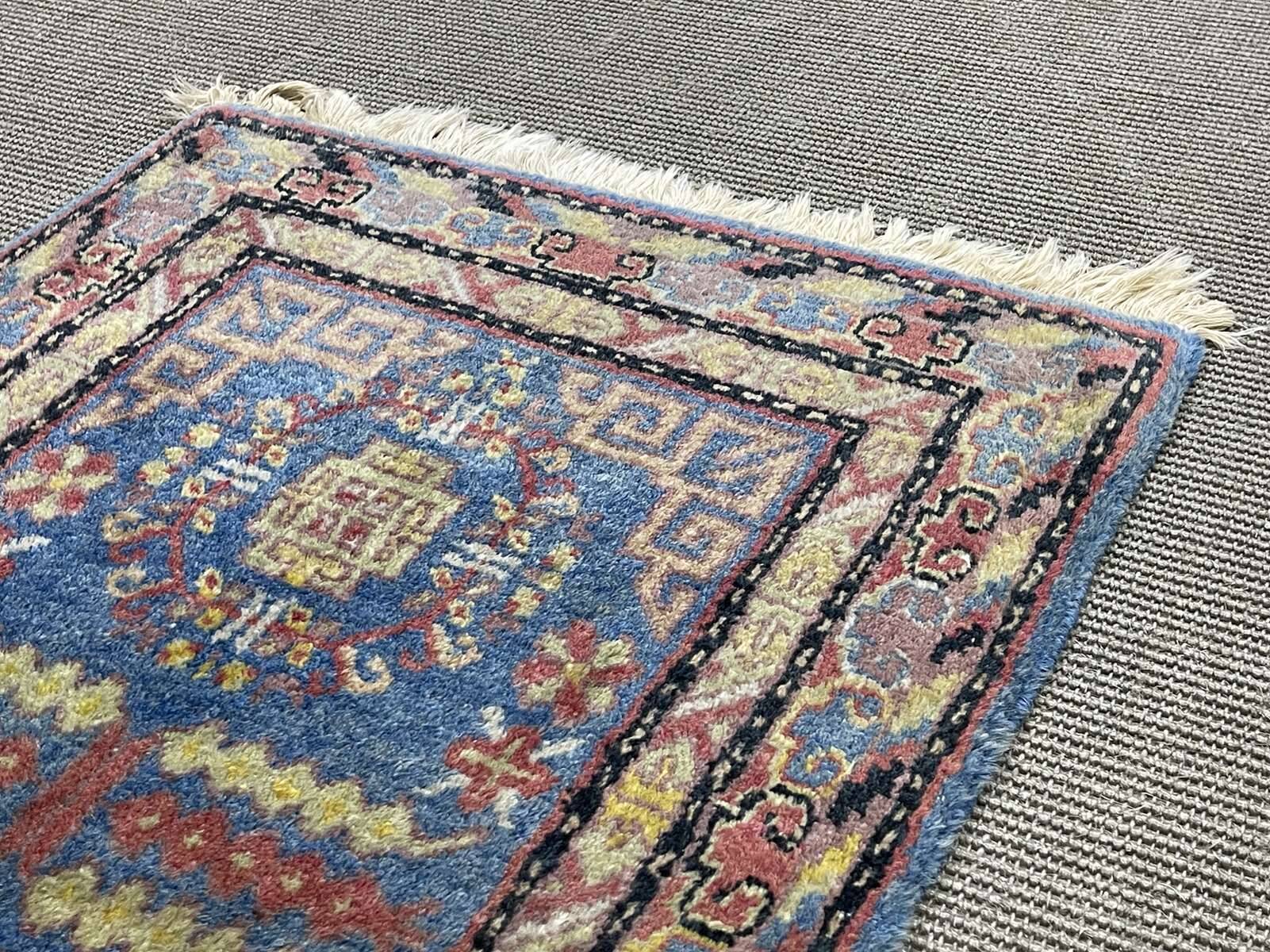 Small handmade wool Iranian rug.
