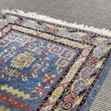 Small handmade wool Iranian rug.