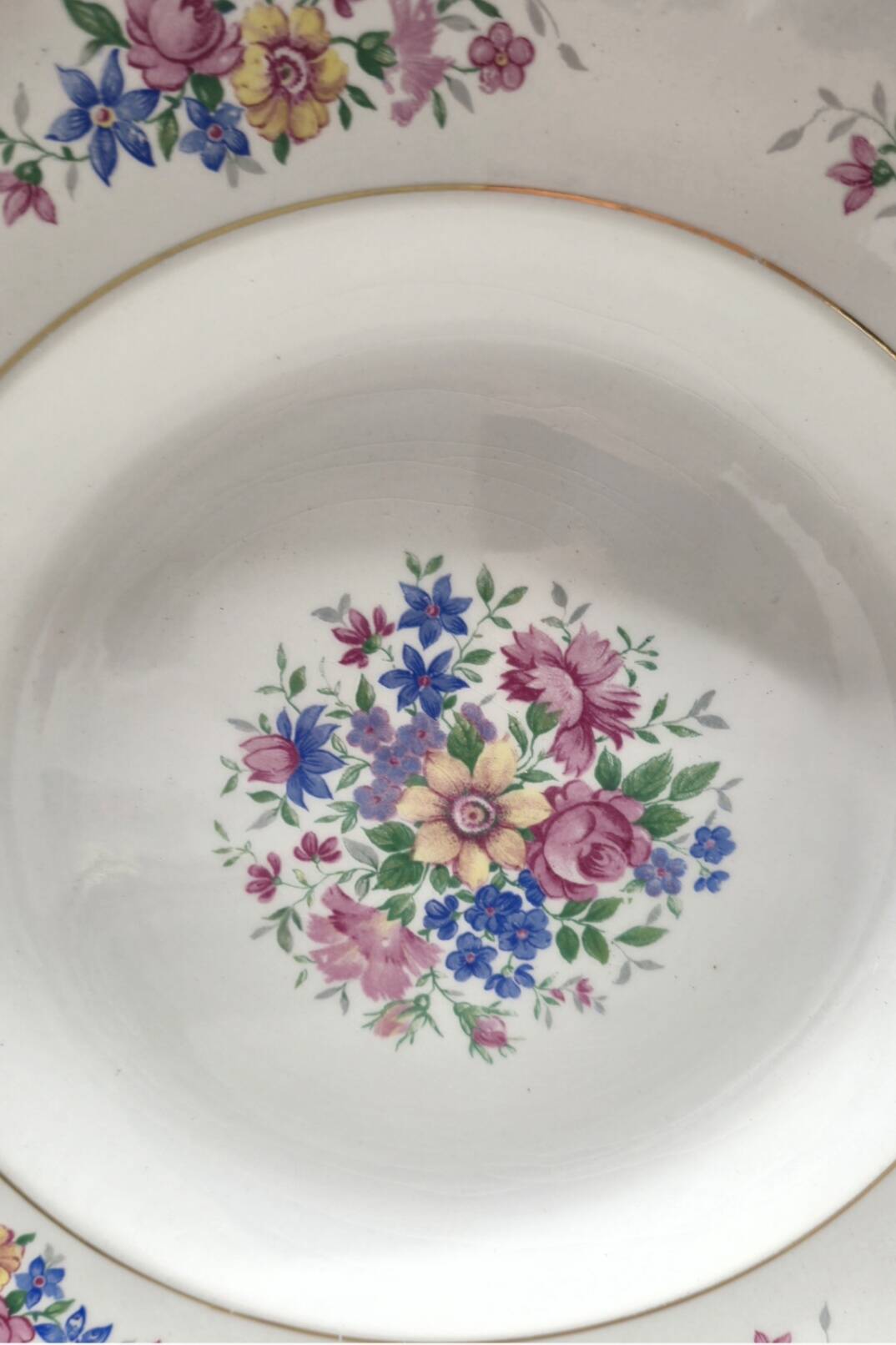 Set of 5 small flowered deep plates.