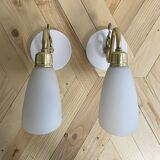 Pair of brass swan neck wall lights with white opaline glass tulip