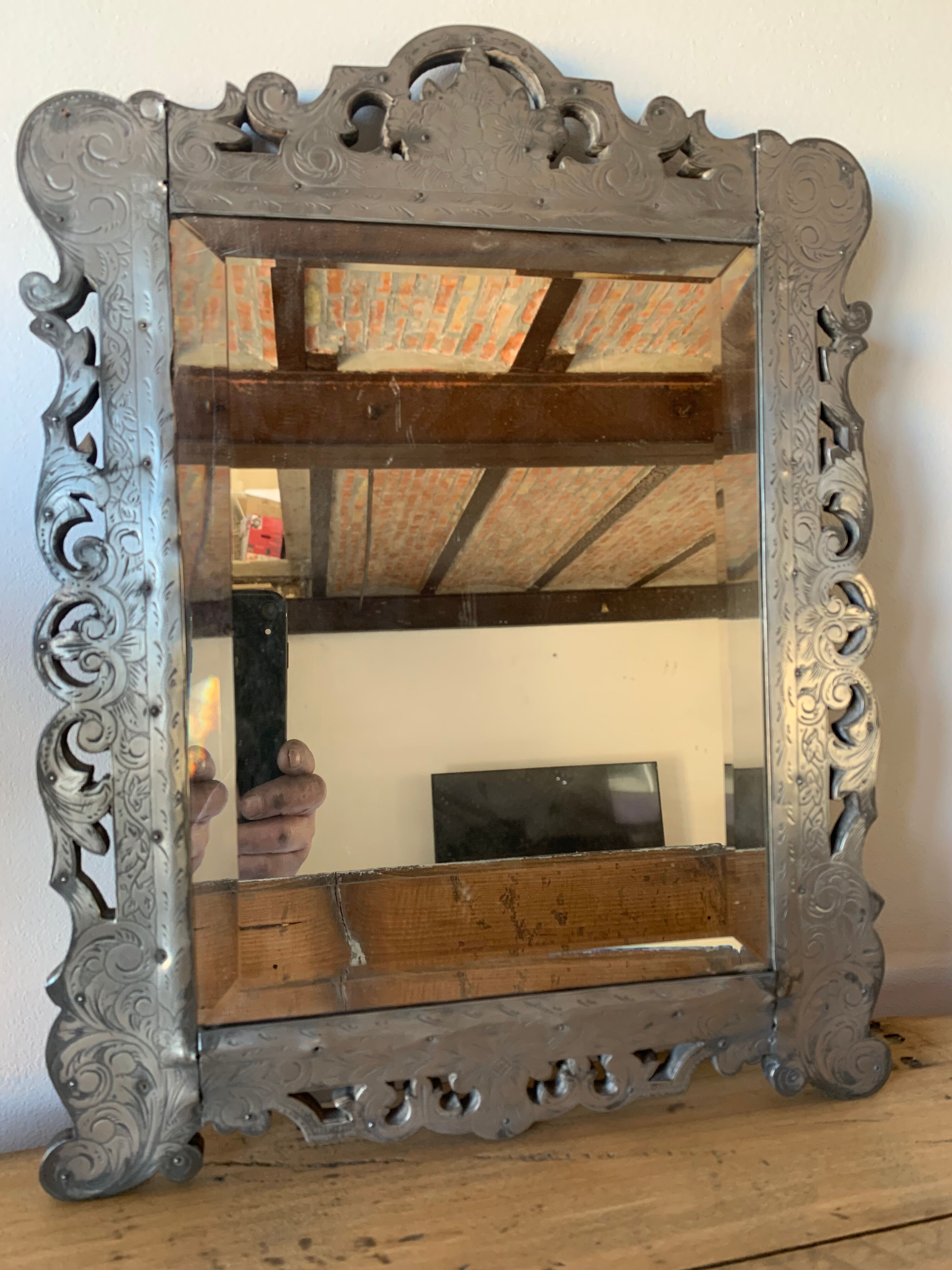 Eventful beveled mirror and openwork period 1900 repelled tin decoration