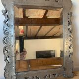 Eventful beveled mirror and openwork period 1900 repelled tin decoration