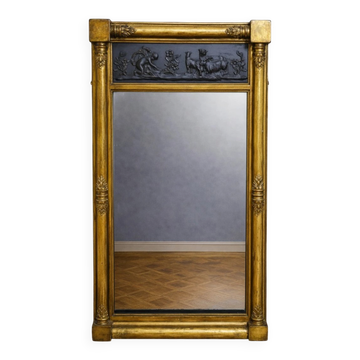 Large antique gilded wooden mirror with terracotta relief from the Empire period.