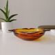 Vintage amber Duralex ashtray from the 1970s.