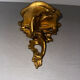 Antique wall-mounted console in gilded wood in rococo style.