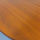 Large vintage Scandinavian round table from the 50s 60s in teak with extensions