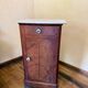 Wood and marble side table with ceramic handles.