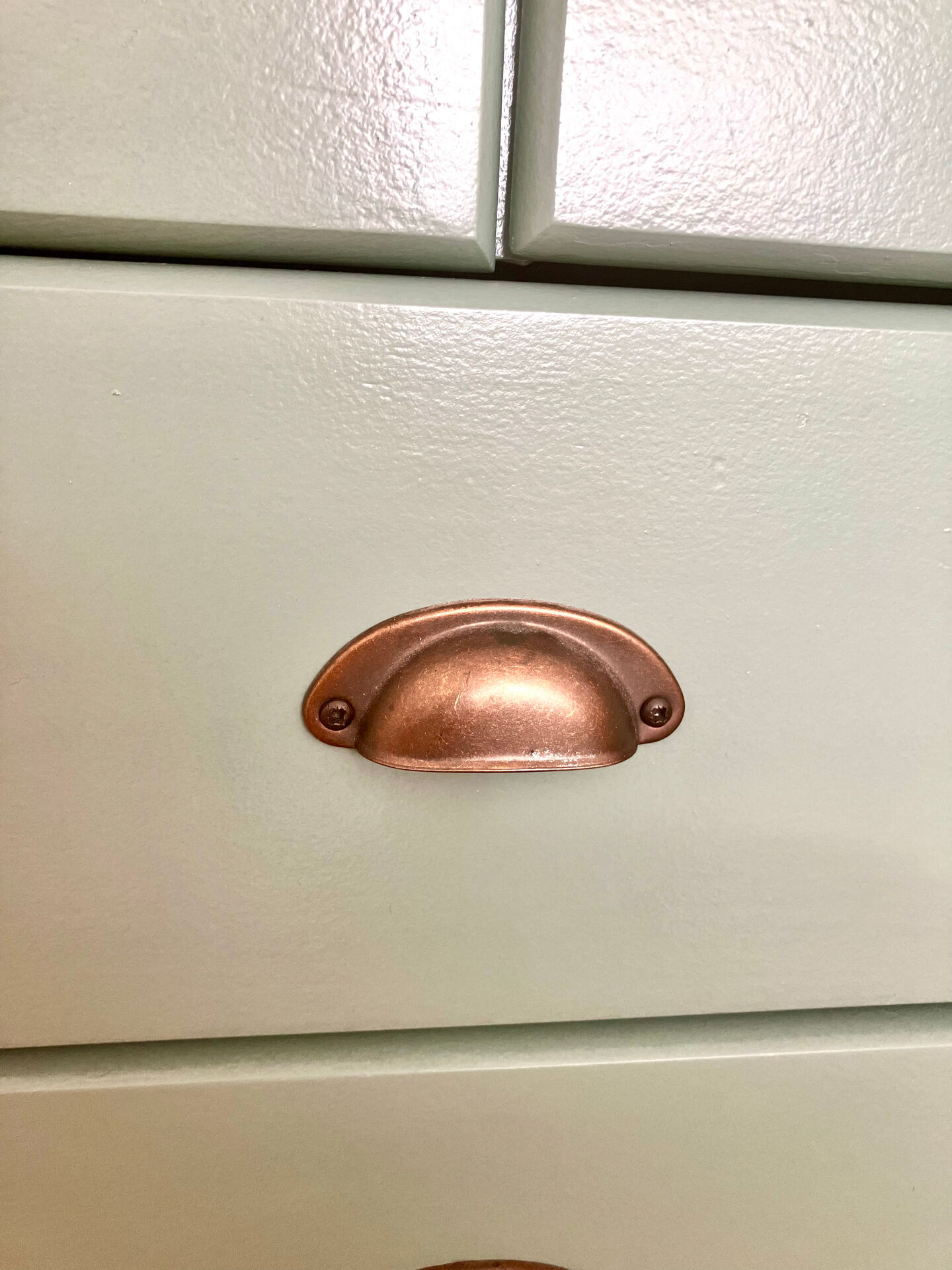 Low buffet with patinated gold handles.