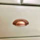 Low buffet with patinated gold handles.
